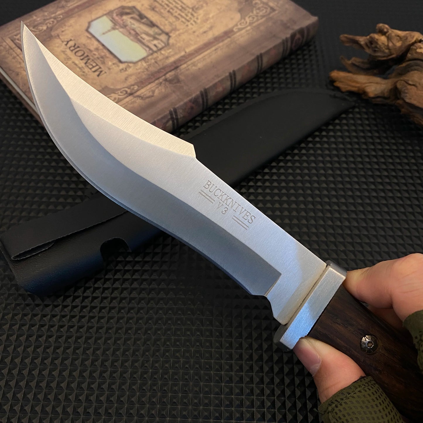 Stainless steel hunting knife with a wooden handle